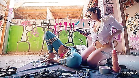 Tattooed woman is doing a great job of playing with her manhood