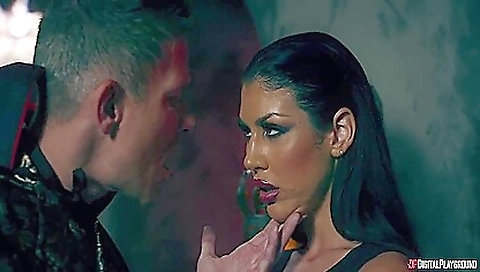 A tattooed brunette babe is having anal fun with a dildo