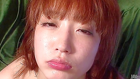 Excellent asian redhead giving a footjob and facejob