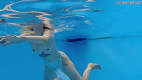 Hot nude girl in a sexy dress in the park in lingerie