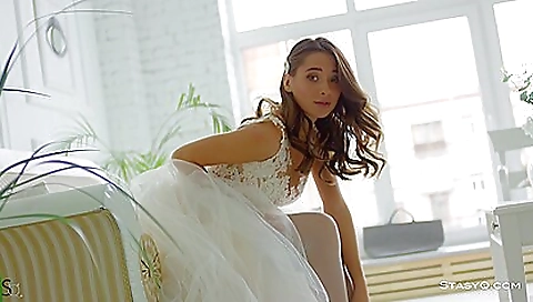 Sexy blonde bride takes a shower in her white stockings