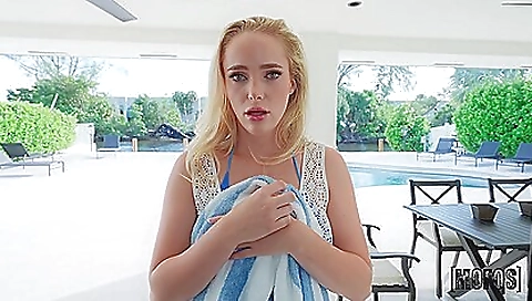 Blonde hottie wearing a black tank top and jeans playing pool ball