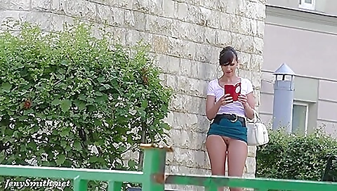 Hot brunette solo female shows her sexy body outdoors