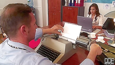 Two busty brunette sluts are fucking in the office