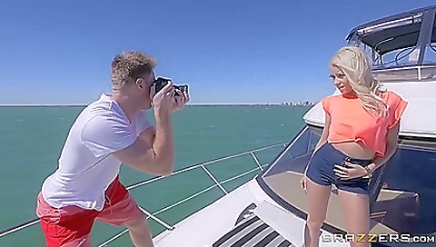 Busty blonde girl with big tits and a tattoo has fun outdoors